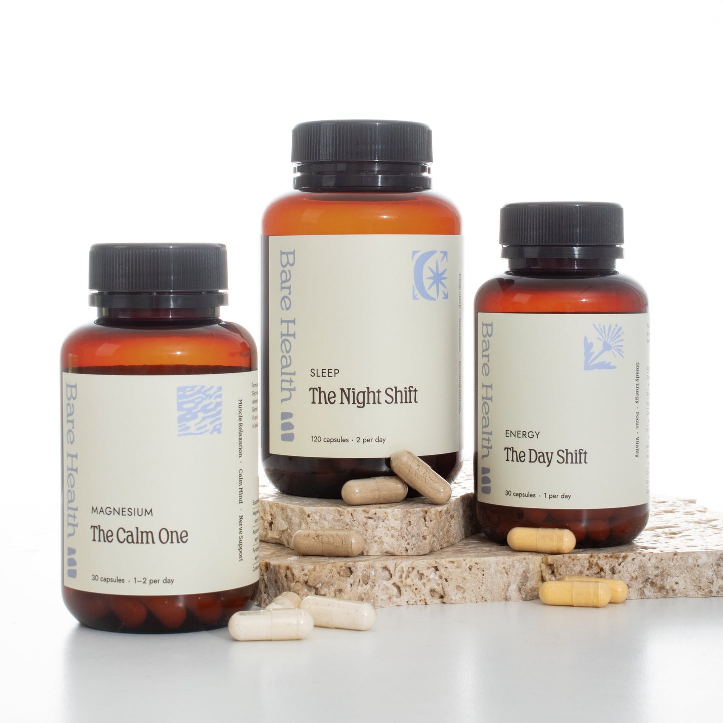 Three supplement bottles labeled 'The Calm One', 'The Night Shift', and 'The Day Shift' on a white background.